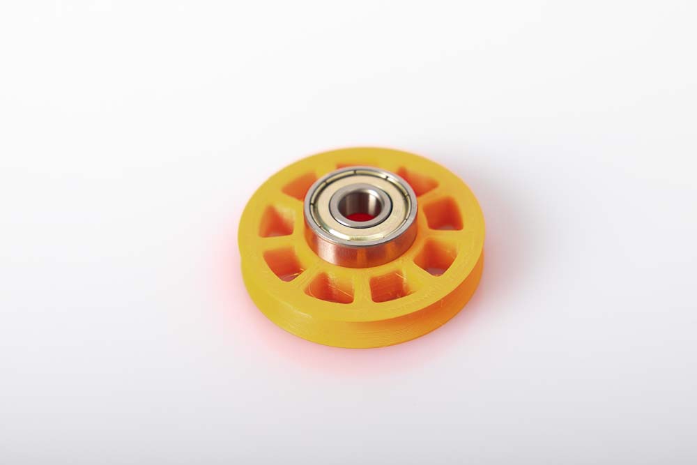 Ball bearing on the filament pulley ready to press in