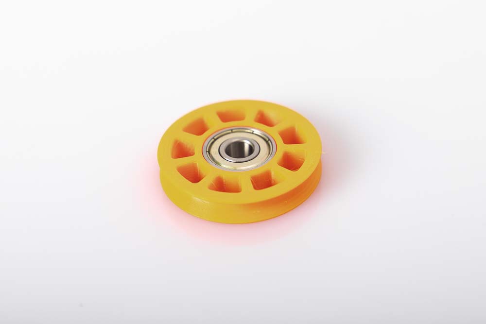 Ball bearing sits in the filament pulley