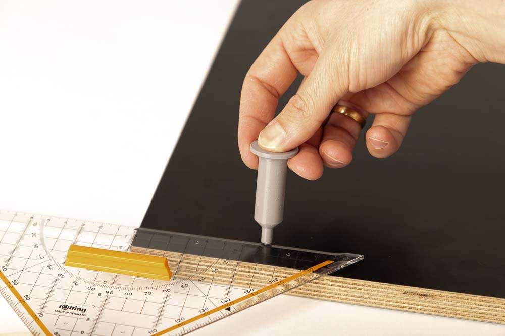 Mark the pilot holes with a ruler