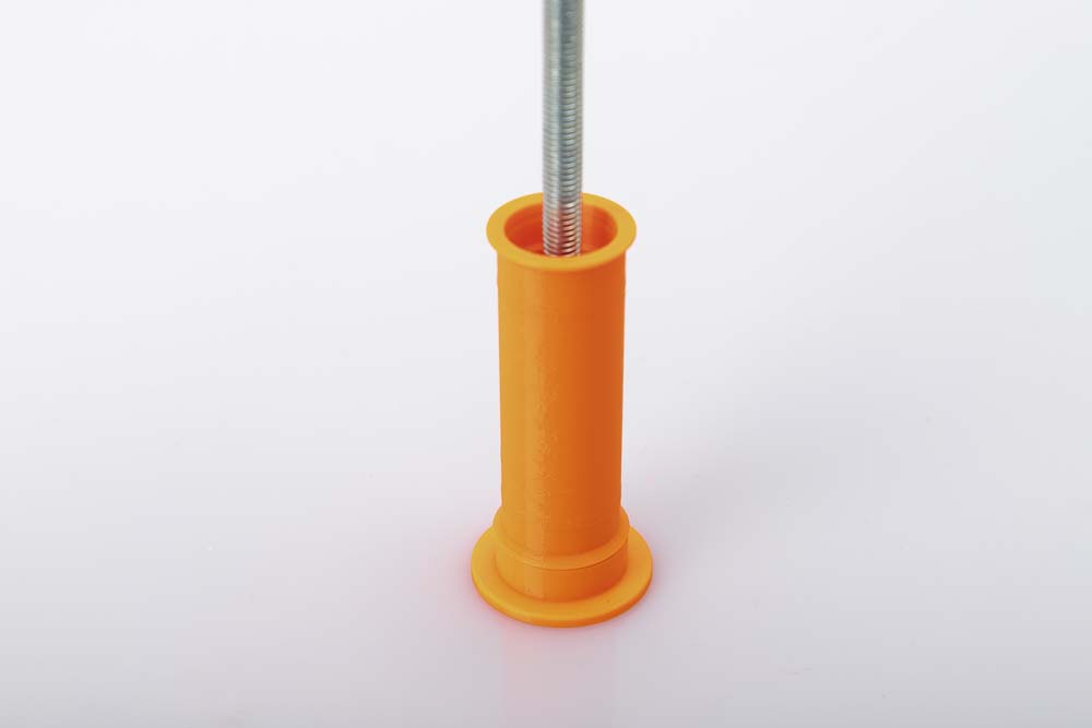 M8 threaded rod with nut in the 3D printed wide pulley with pressed 608 ball bearings. The pulley sits on the 3D printed tool press-out counter.