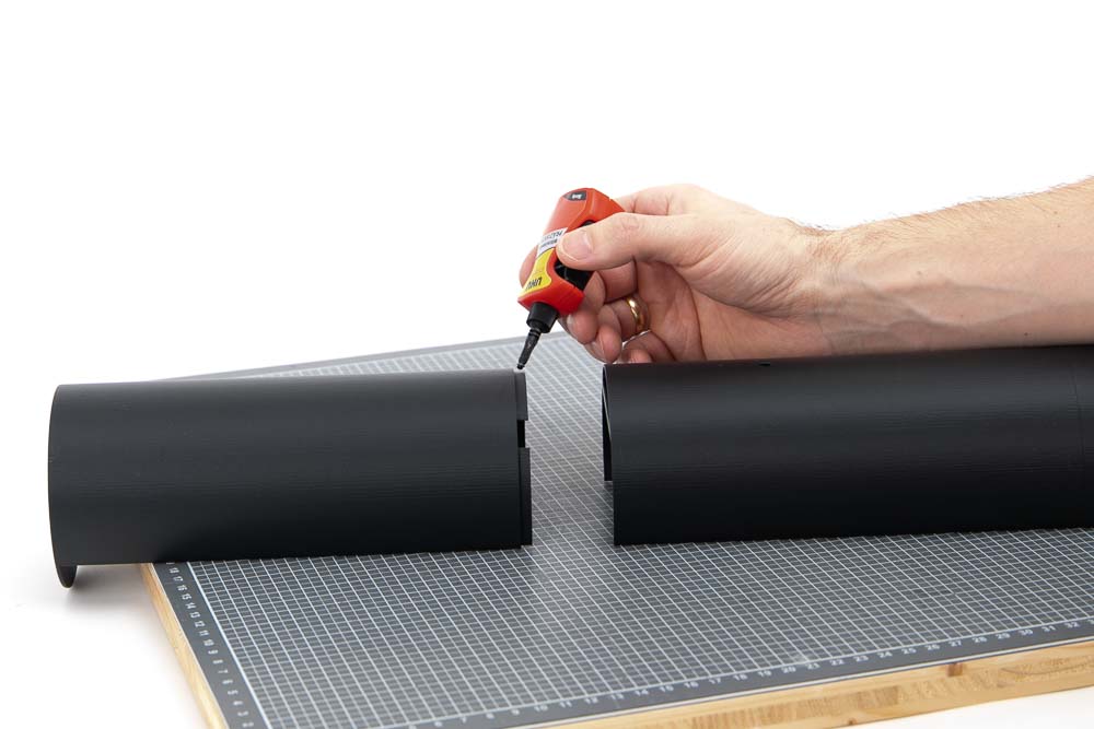 Applying the adhesive to one of the outer parts of the 3D printed pendant lamp