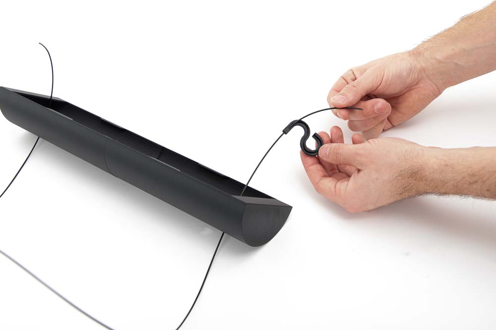 Filament is secured with the 3D printed filament fixation parts, thread it into the part