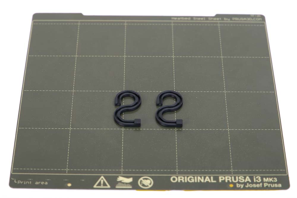 3D printed filament fixtures of the self-built 3D printed LED pendant light on a print plate of a Prusa MK3s