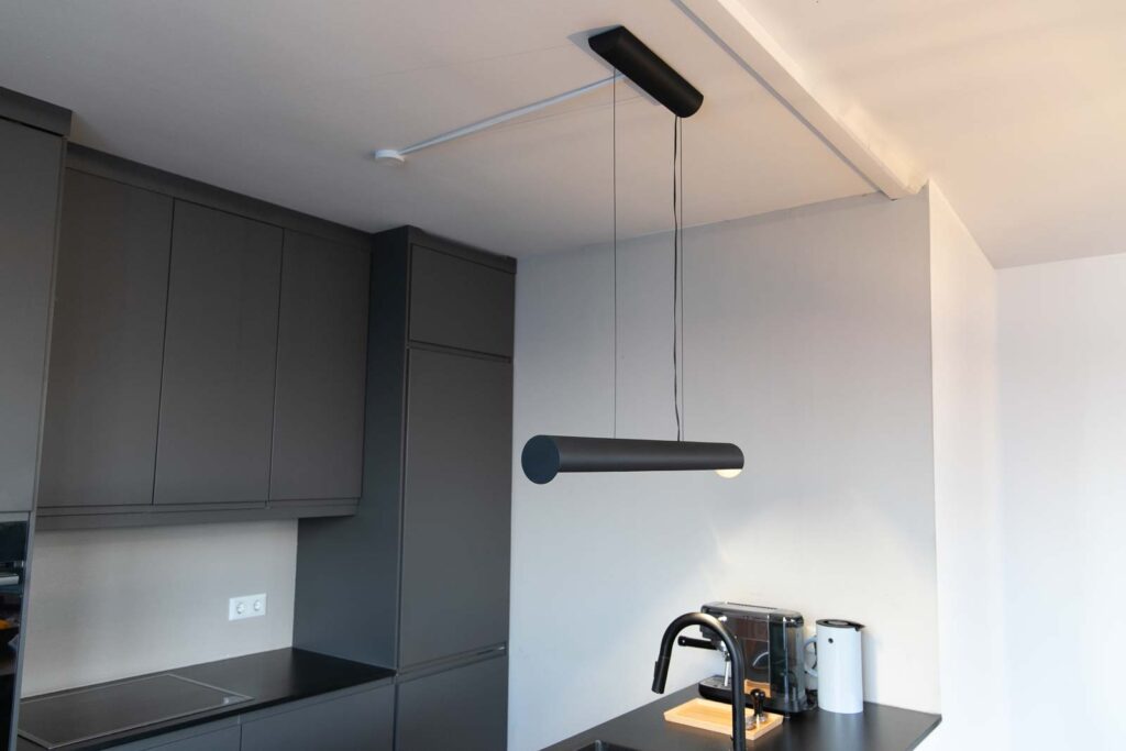 Ready-assembled 3D printed design pendant lamp mounted above a kitchen island